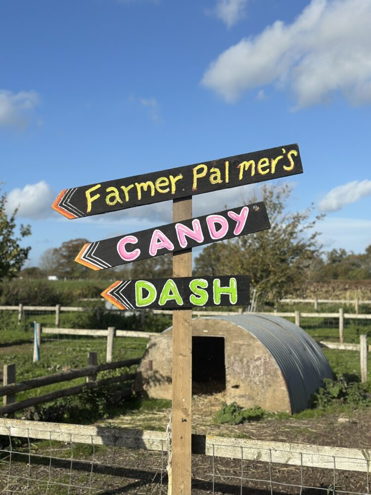 Farmer palmers candy dash sign outside a pig sty
