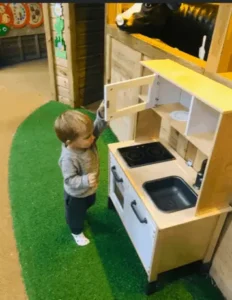 child lookin at a kitchen