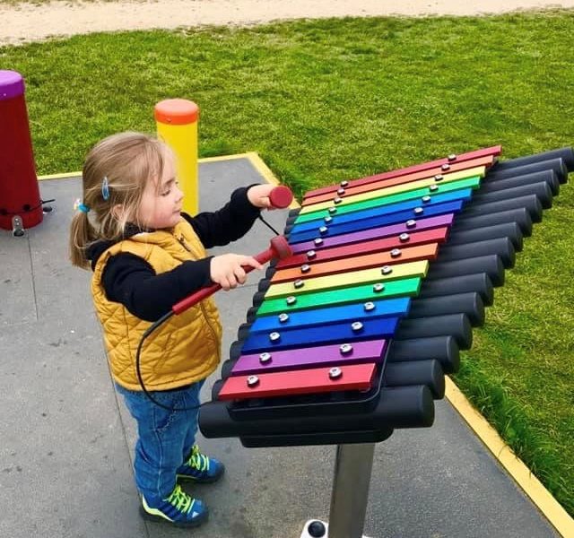 Child enjoying an autumn family day out at Farmer Palmer’s Farm Park in Dorset