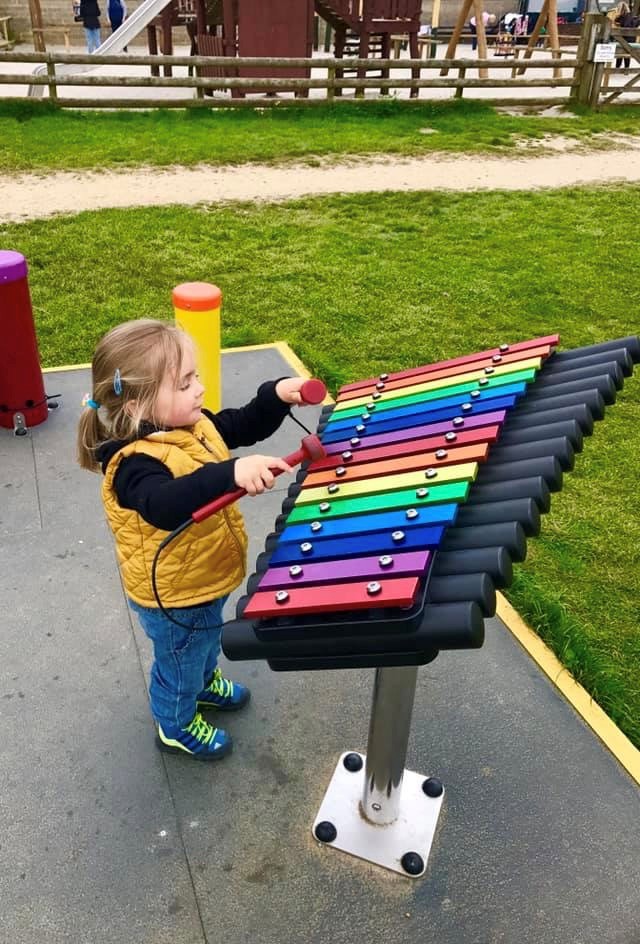 Child enjoying an autumn family day out at Farmer Palmer’s Farm Park in Dorset