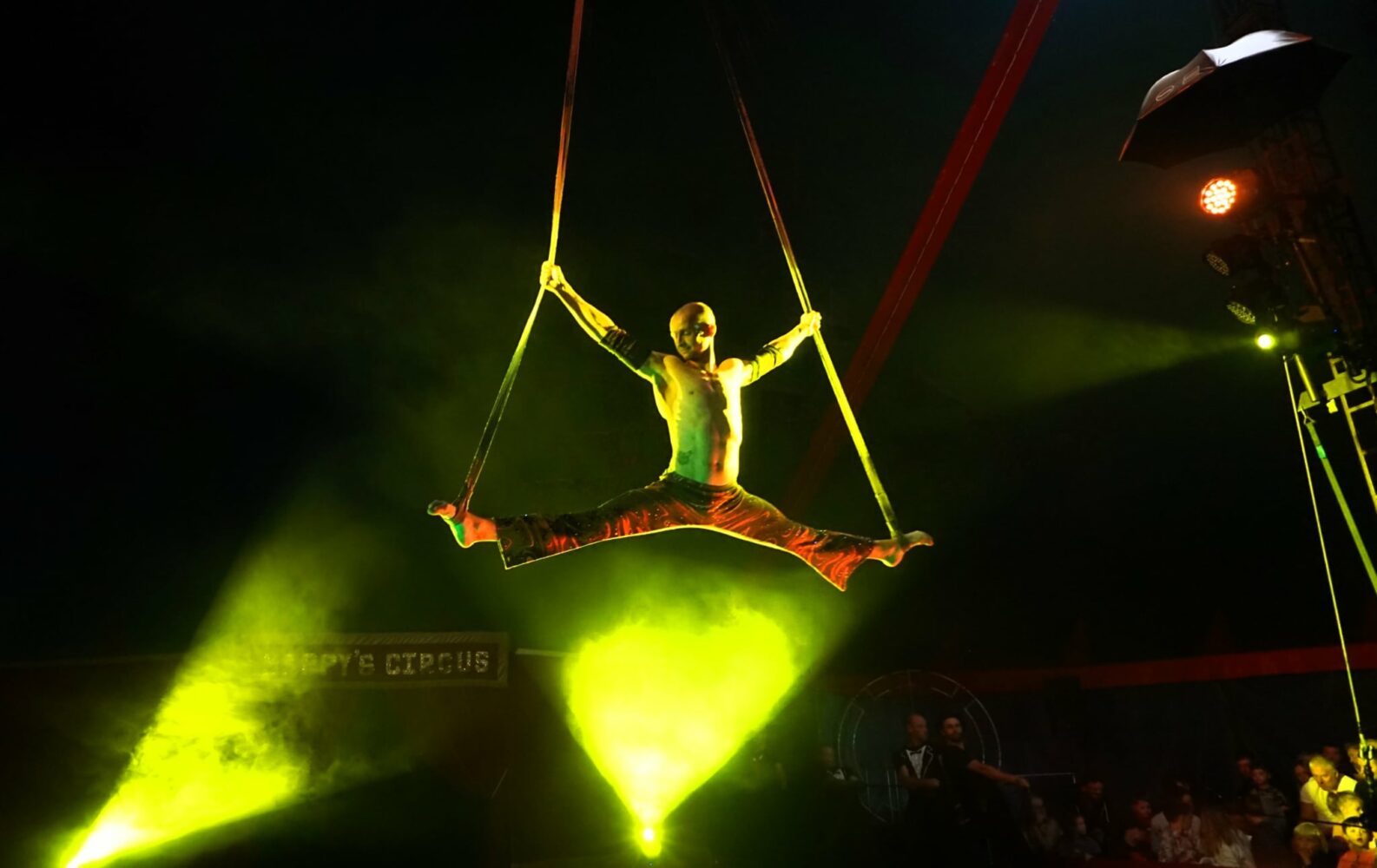 Happys Circus performers man on high ropes