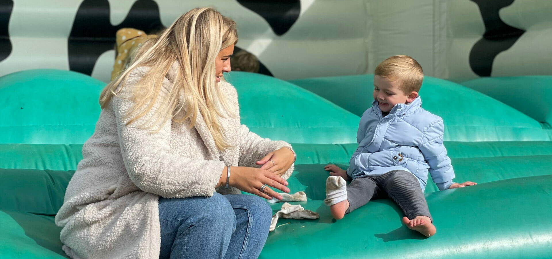 putting on shoes at the outdoor bouncy castle