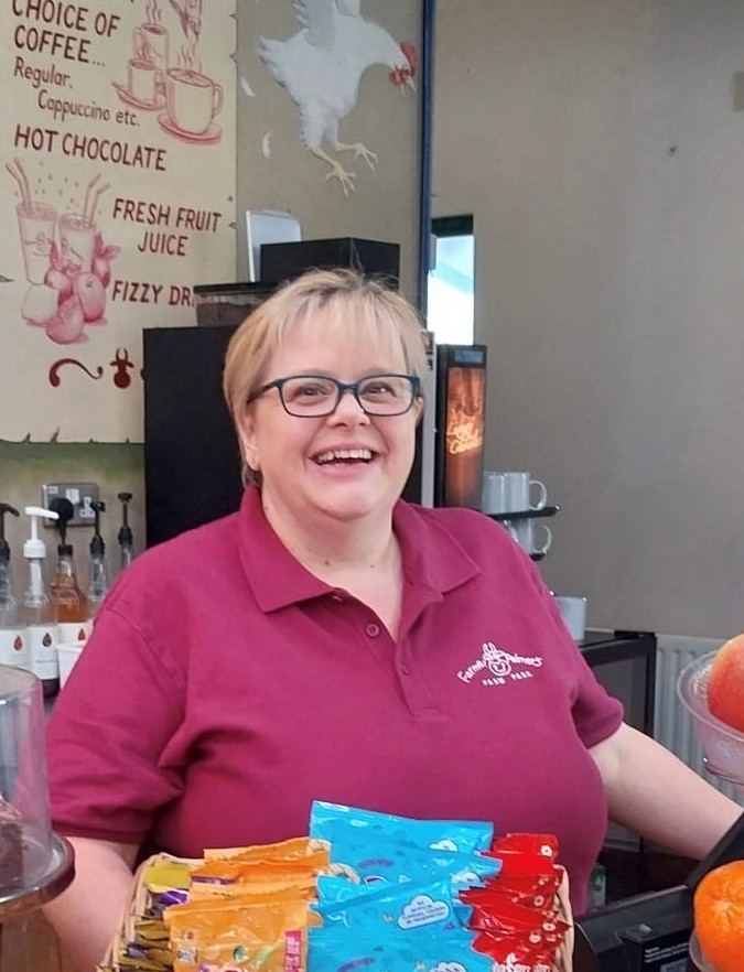 Carolyn Lady with glasses in Farmer Palmer tshirt in Hen house restaurant.