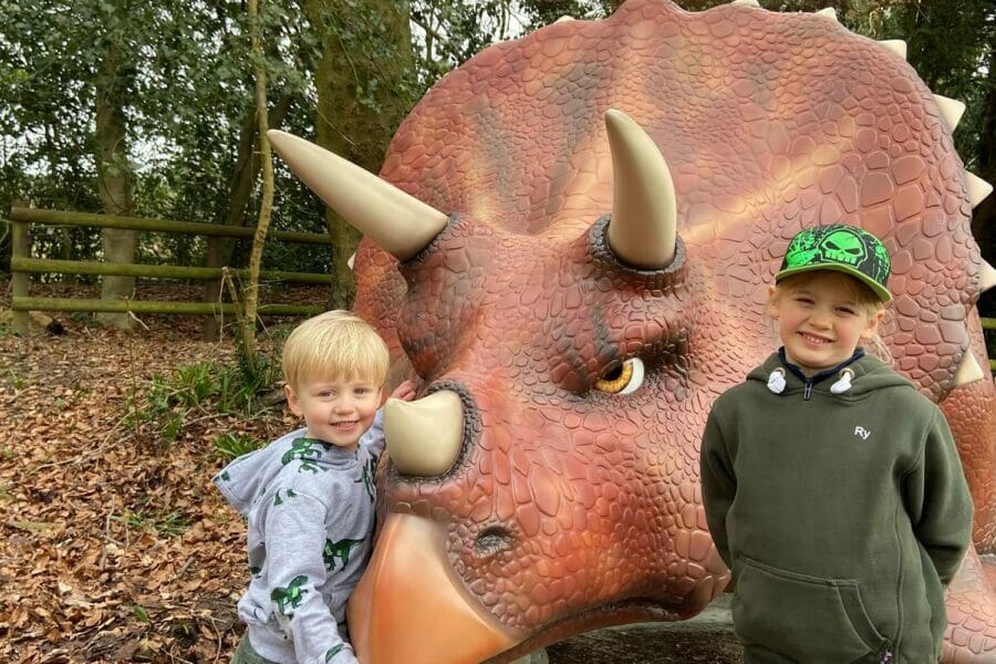 Kids hugging the triceratops